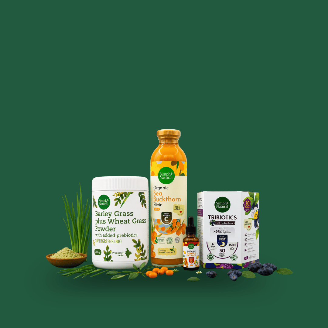 A product bundle of three health and wellness items from Nature's Way: a container of Bailey Grass plus Wheat Grass Powder, a bottle of Organic Seed Backthorn Elder juice, and a box of Tribiotics 3D Probiotics, arranged on a dark green background with natural ingredients like wheat, berries, and a clove.